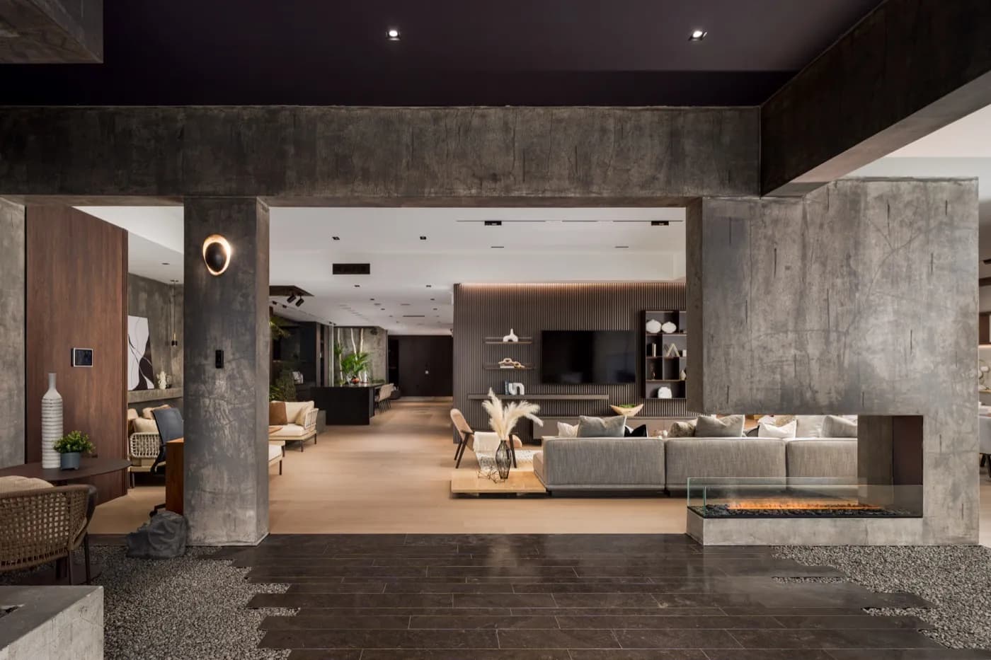 Showroom lounge seen through the concrete archway