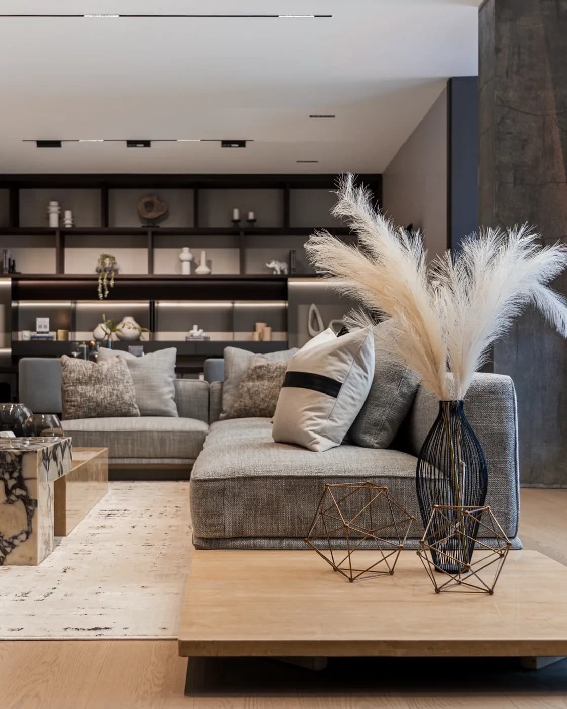 Grey sectional styled with pampas grass
